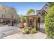 Elegant gated entrance featuring brick pillars, lush landscaping, and secure access to the community at 1954 Saxon Valley Ne Cir, Brookhaven, GA 30319