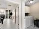 Bright laundry room featuring modern appliances, stylish tiling, and easy access to main bedroom at 1954 Saxon Valley Ne Cir, Brookhaven, GA 30319
