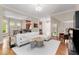 Bright and spacious living room with hardwood floors, opening to the kitchen, great for entertaining at 1954 Saxon Valley Ne Cir, Brookhaven, GA 30319