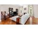 Bright living room featuring hardwood floors, a fireplace, and large windows for ample natural light at 1954 Saxon Valley Ne Cir, Brookhaven, GA 30319