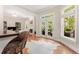 An open floor plan showcases a living room and access to an outdoor seating area at 1954 Saxon Valley Ne Cir, Brookhaven, GA 30319