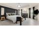 Stunning main bedroom with a fireplace, statement lighting, and a modern accent wall at 1954 Saxon Valley Ne Cir, Brookhaven, GA 30319