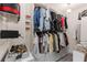 Well-organized walk-in closet with custom shelving, hanging racks, and ample storage space at 1954 Saxon Valley Ne Cir, Brookhaven, GA 30319