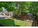 Backyard view of the home featuring a green lawn, dark fence, and inviting deck at 198 Clay Se St # G, Atlanta, GA 30317