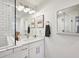 Bright bathroom with white marble countertops, modern fixtures, and a framed mirror at 198 Clay Se St # G, Atlanta, GA 30317