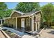 Charming home with a well-manicured lawn, complemented by lush greenery and a cozy front porch with colorful flower baskets at 198 Clay Se St # G, Atlanta, GA 30317