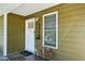 Charming front door with a window and the address displayed next to it, with a small wooden table under a window at 198 Clay Se St # G, Atlanta, GA 30317
