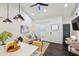 Bright open-concept living space with vaulted ceiling, sleek ceiling fan, and access to the kitchen island at 198 Clay Se St # G, Atlanta, GA 30317