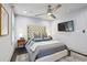 Comfortable bedroom featuring a neutral color palette, ceiling fan, and dark wood flooring at 198 Clay Se St # G, Atlanta, GA 30317