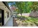 Lush backyard featuring a screened-in porch, verdant lawn, mature trees, and privacy fencing at 2301 Crestcliff Dr, Tucker, GA 30084