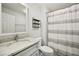 Bathroom with marble countertop, patterned tile floor, and shower with curtain at 2301 Crestcliff Dr, Tucker, GA 30084