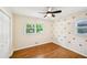 Bedroom featuring hardwood floors, ceiling fan and natural light at 2301 Crestcliff Dr, Tucker, GA 30084