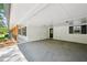 A spacious painted brick carport provides sheltered parking and seamless access to the home at 2301 Crestcliff Dr, Tucker, GA 30084