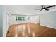 Open-concept living room showcasing gleaming hardwood floors and neutral wall color at 2301 Crestcliff Dr, Tucker, GA 30084