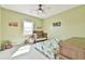 Bright bedroom with a playful design and large window allowing for natural light at 5315 Hendrix Rd, Cumming, GA 30040