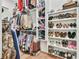 Walk-in closet features custom shelving, ample storage for clothes, shoes, and accessories at 5315 Hendrix Rd, Cumming, GA 30040