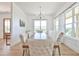 Elegant dining room featuring a rustic wooden table and comfortable seating with bright windows at 5315 Hendrix Rd, Cumming, GA 30040