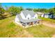 Beautiful two-story home with a covered porch and lush green surroundings at 5315 Hendrix Rd, Cumming, GA 30040