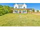 Charming two-story farmhouse with a covered front porch, rocking chairs, and manicured lawn at 5315 Hendrix Rd, Cumming, GA 30040