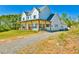 Charming two-story home with a long covered porch and landscaped yard at 5315 Hendrix Rd, Cumming, GA 30040