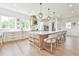 Well-appointed kitchen with custom cabinetry, large island, and stainless steel appliances, open to the dining area at 5315 Hendrix Rd, Cumming, GA 30040