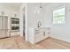 Bright kitchen area with stainless steel appliances and a convenient wet bar near an adjacent pantry at 5315 Hendrix Rd, Cumming, GA 30040