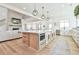 Bright kitchen with a large island featuring custom cabinetry, white countertops, and modern appliances at 5315 Hendrix Rd, Cumming, GA 30040