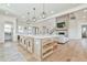 Stunning kitchen with a large center island, modern appliances, and an open layout to the living space at 5315 Hendrix Rd, Cumming, GA 30040