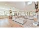 Expansive open-concept living room featuring a fireplace and seamless flow to the gourmet kitchen at 5315 Hendrix Rd, Cumming, GA 30040