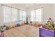 Bright playroom with large windows, light wood floors, and plenty of space for activities at 5315 Hendrix Rd, Cumming, GA 30040