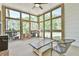 Relaxing sunroom filled with lots of natural light and backyard views at 5315 Hendrix Rd, Cumming, GA 30040