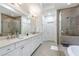 Modern bathroom with double vanity, granite counters, soaking tub, and glass shower at 57 Weston Dr # 13, Atlanta, GA 30328