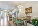 Open-concept dining room with modern light fixtures, adjacent to the kitchen, ideal for entertaining at 57 Weston Dr # 13, Atlanta, GA 30328
