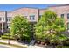 Beautiful brick townhome with mature trees, professional landscaping, and inviting entryway at 57 Weston Dr # 13, Atlanta, GA 30328