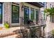 Inviting front porch with brick steps and black railing at 57 Weston Dr # 13, Atlanta, GA 30328