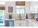 Bright kitchen area with stainless steel appliances, a double sink, and view of the back deck at 57 Weston Dr # 13, Atlanta, GA 30328