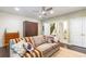 Inviting living room featuring a comfortable couch, Murphy bed and neutral patterned wallpaper at 57 Weston Dr # 13, Atlanta, GA 30328