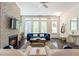 Bright and cozy living room with hardwood floors, fireplace, and lots of windows at 57 Weston Dr # 13, Atlanta, GA 30328