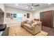Cozy living room with a plush sofa, Murphy bed, and a collection of vintage posters at 57 Weston Dr # 13, Atlanta, GA 30328