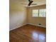 Bright bedroom with hardwood flooring and a sunlit window at 4589 Mesaview Way, Stone Mountain, GA 30083