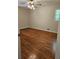 Cozy bedroom featuring hardwood floors and neutral wall paint at 4589 Mesaview Way, Stone Mountain, GA 30083