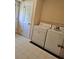 Functional laundry room with appliances and access to outdoor area at 4589 Mesaview Way, Stone Mountain, GA 30083