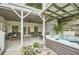 Back porch with hot tub, ceiling fan, and ample seating area at 1059 Antioch Dr, Brookhaven, GA 30319