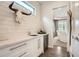 Stylish bar area featuring elegant cabinetry, sleek countertop, built-in wine cooler, with an adjacent dining area at 1059 Antioch Dr, Brookhaven, GA 30319