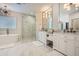 Luxurious bathroom with a freestanding tub, glass-enclosed shower, dual vanities, and marble flooring at 1059 Antioch Dr, Brookhaven, GA 30319