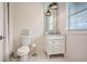 Cozy bathroom with a decorative sign, single vanity, and shower featuring modern fixtures at 1059 Antioch Dr, Brookhaven, GA 30319