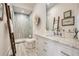 Elegant bathroom featuring a marble countertop, white cabinets, glass shower, and unique decorative ladder at 1059 Antioch Dr, Brookhaven, GA 30319