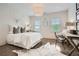 Comfortable bedroom with a work space, natural light, decorative accents, and hardwood floors at 1059 Antioch Dr, Brookhaven, GA 30319