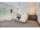 Inviting bedroom featuring neutral tones, plush carpet, a comfortable bed, and bright natural light at 1059 Antioch Dr, Brookhaven, GA 30319