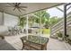 Inviting covered patio with ceiling fan, hot tub, dining table and plenty of room for entertaining or relaxing at 1059 Antioch Dr, Brookhaven, GA 30319